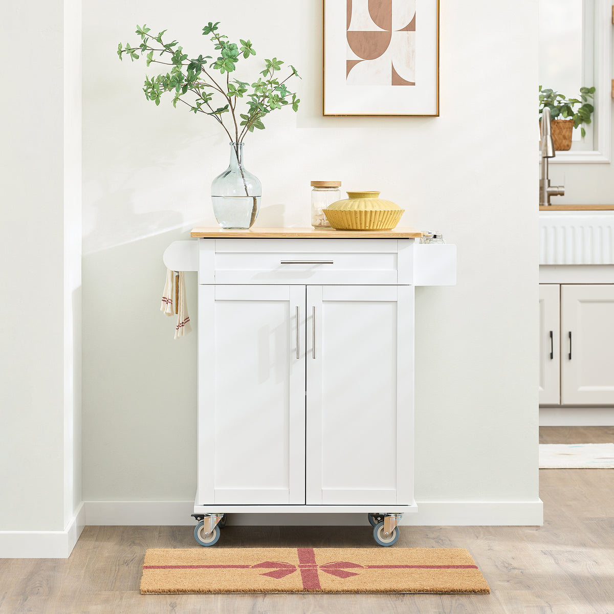SoBuy FKW13-II-WN white rolling kitchen trolley in kitchen setting – bamboo worktop spice rack drawer and double cabinet