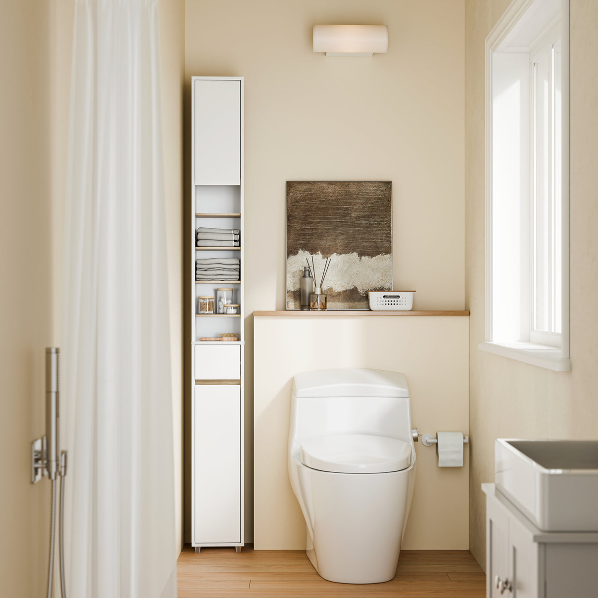 Slim freestanding bathroom tallboy cabinet in small UK bathroom beside toilet