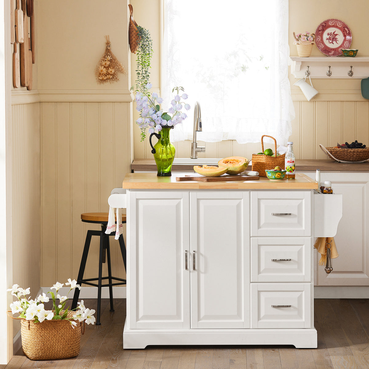 SoBuy FKW41-III-WN freestanding white kitchen island in modern kitchen setting with extended rubber wood worktop 130cm wide