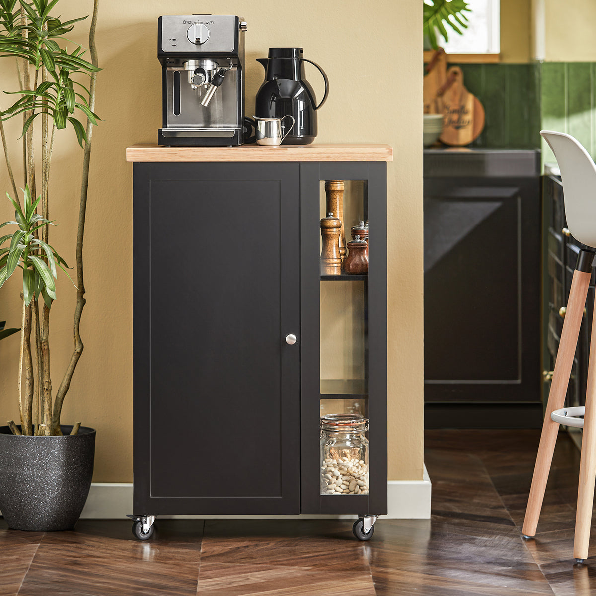 SoBuy FKW75-SCH compact black kitchen trolley in modern kitchen as mobile coffee station with 3-tier side rack and cabinet storage