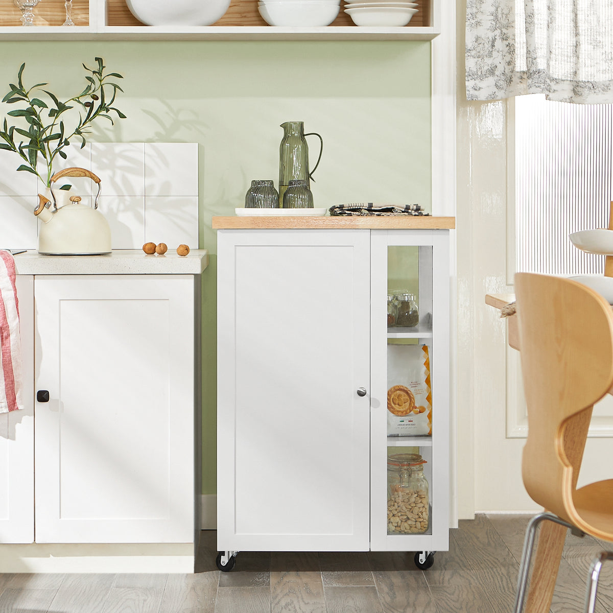 SoBuy FKW75-WN compact white kitchen trolley in modern kitchen setting with rubber wood worktop and 3-tier side rack