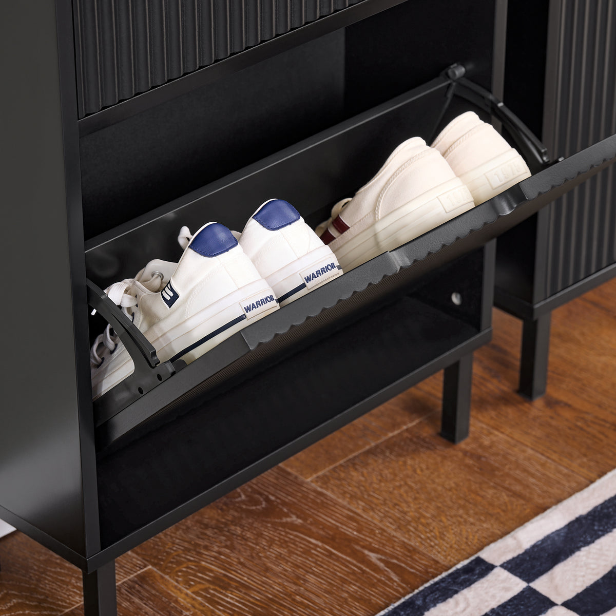 Equipped with 2 quiet flip-drawers with vented cut-out handles, this black shoe cupboard keeps your shoes dust-free, odour-free