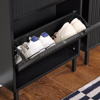 Equipped with 2 quiet flip-drawers with vented cut-out handles, this black shoe cupboard keeps your shoes dust-free, odour-free