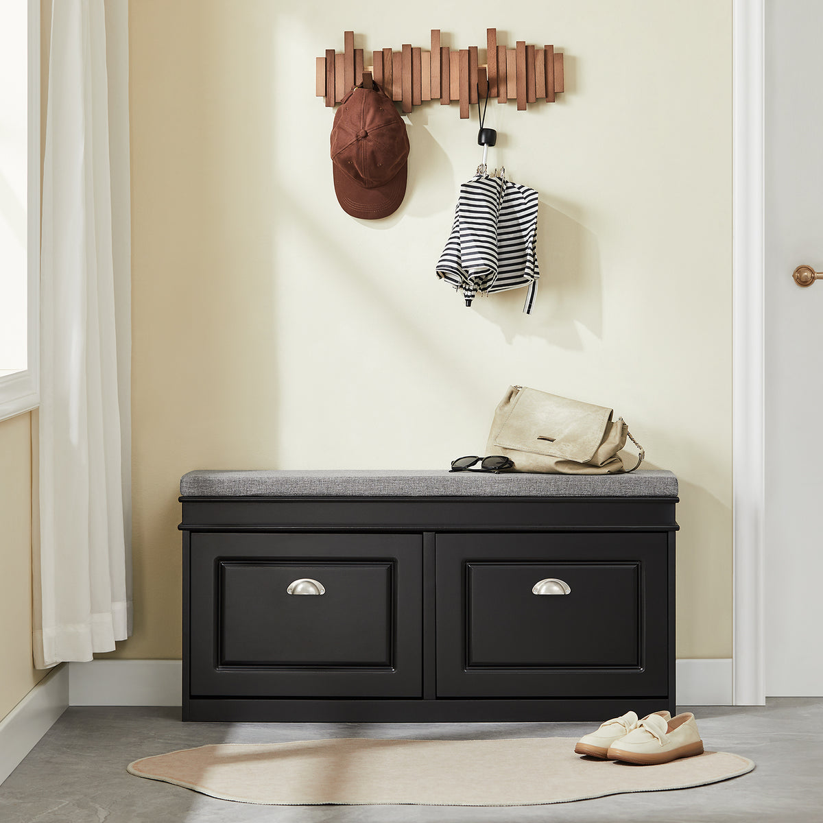 SoBuy FSR64-SCH black shoe bench with padded seat in hallway entryway scene