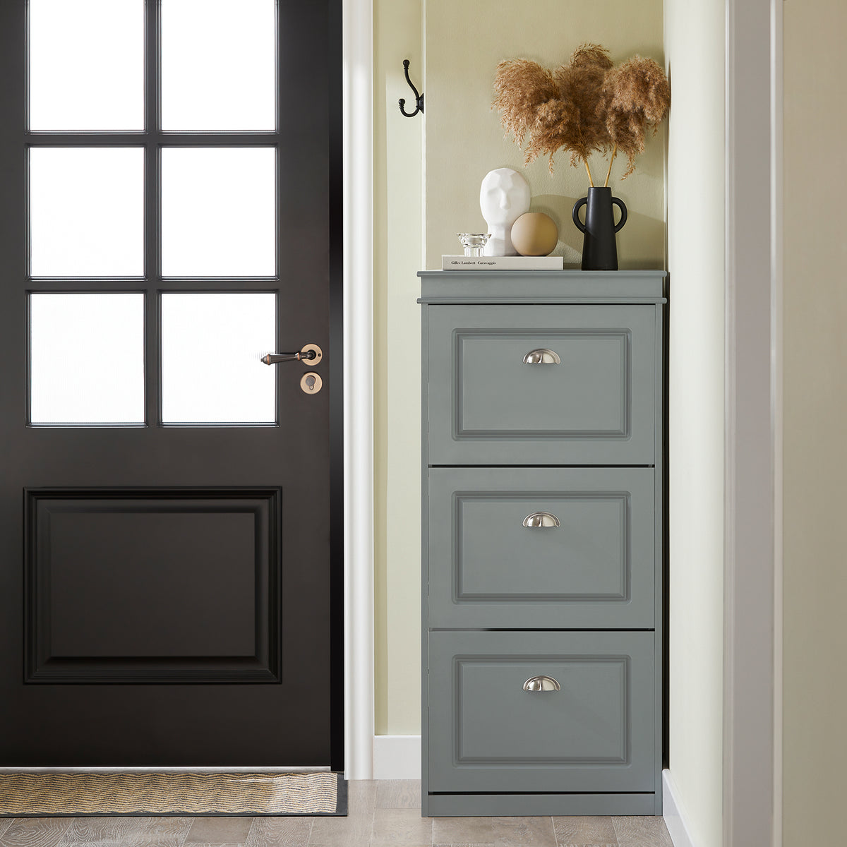 Slim grey hallway shoe cupboard 53cm wide in entryway.