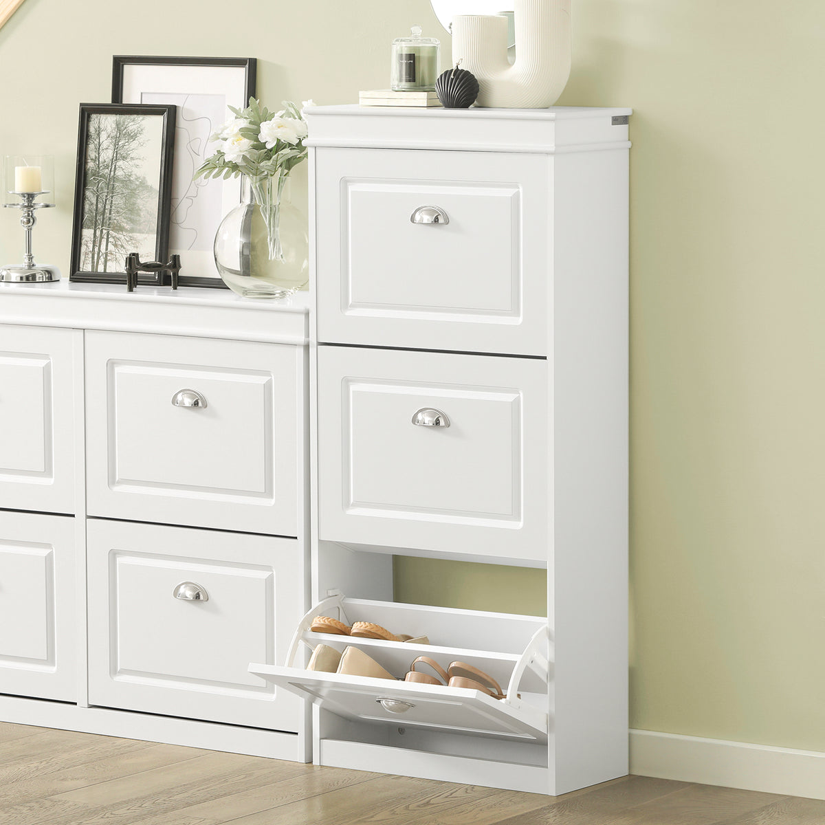white shoe storage unit beside front door in narrow corridor