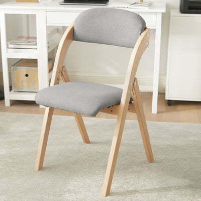 SoBuy FST92-N light grey ergonomic folding chair in dining room setting – 120kg load capacity space-saving chair